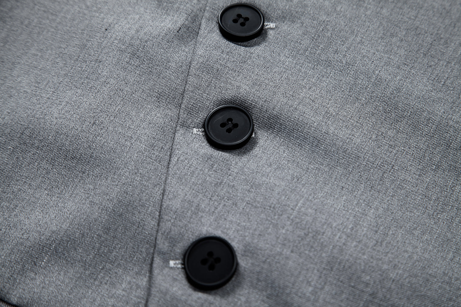 Black # Men's solid color single-breasted slanted placket vest, slim fit V-neck casual suit waistcoat with button-down closure and belt-on back, versatile lightweight polyester vest for daily wear, business, wedding, party and formal events, isolated on white background.