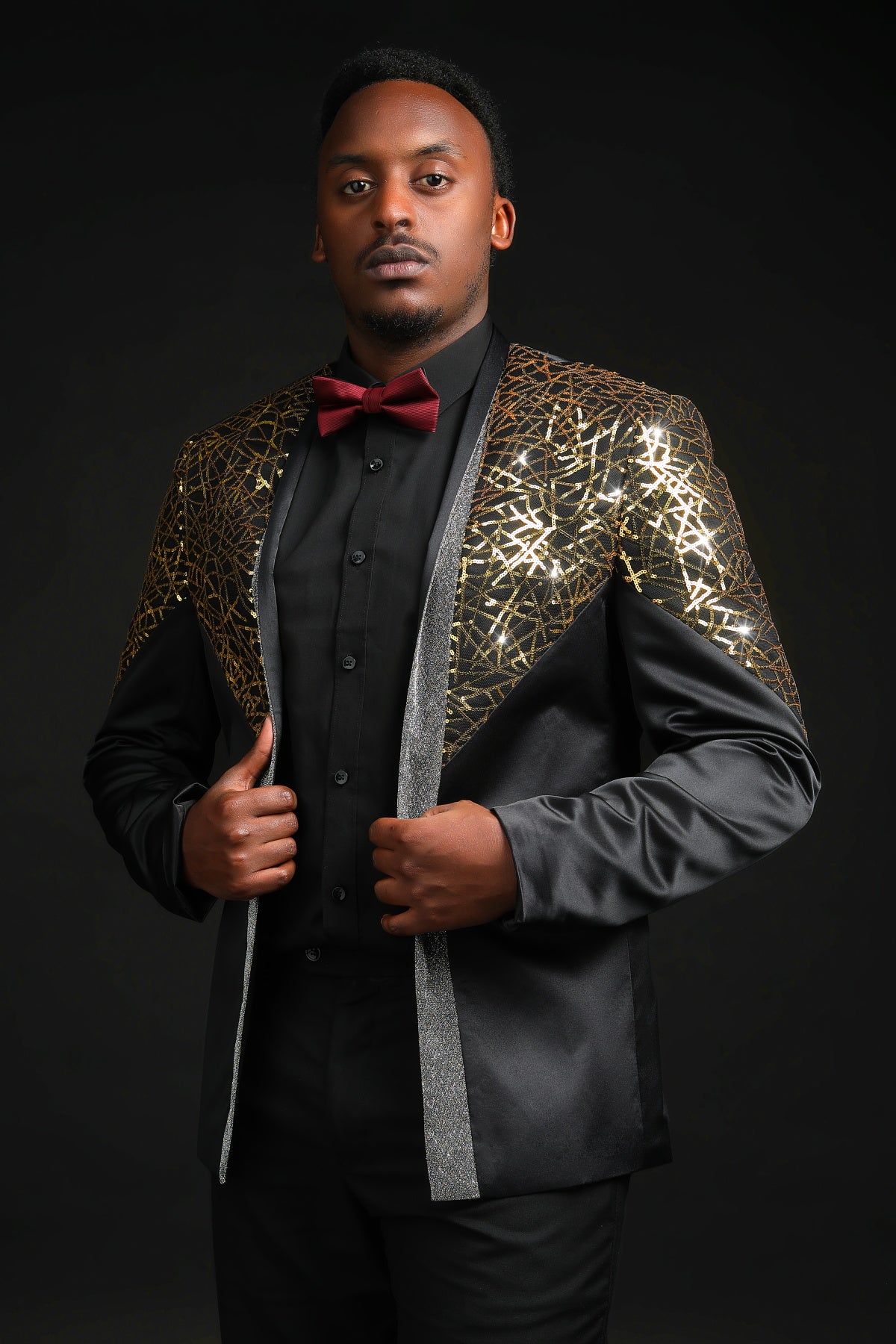 Gold # Men's sequined stand collar single-breasted blazer with 1-button closure, shiny gold sequin pattern sport coat jacket with 3D tailored fit for party, prom, wedding, stage performance and special occasions, isolated on white background.
