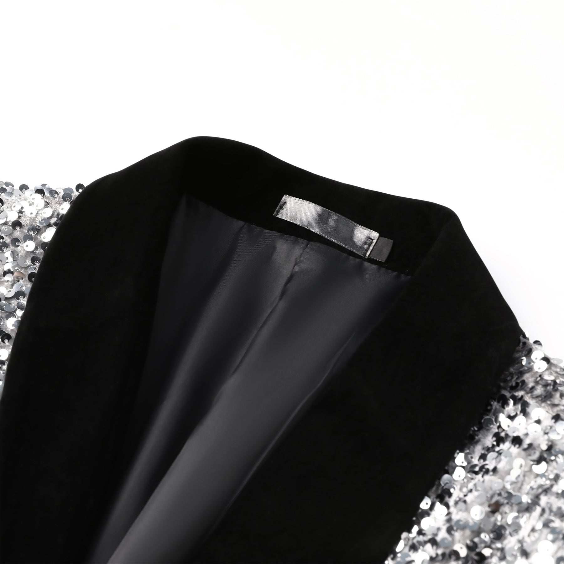 White # Men's shiny sequin suit jacket with velvet shawl lapel and one-button closure, tailored-fit tuxedo blazer with sparkling white sequins for dinner party, prom, cocktail, wedding, and stage performance, isolated on white background.