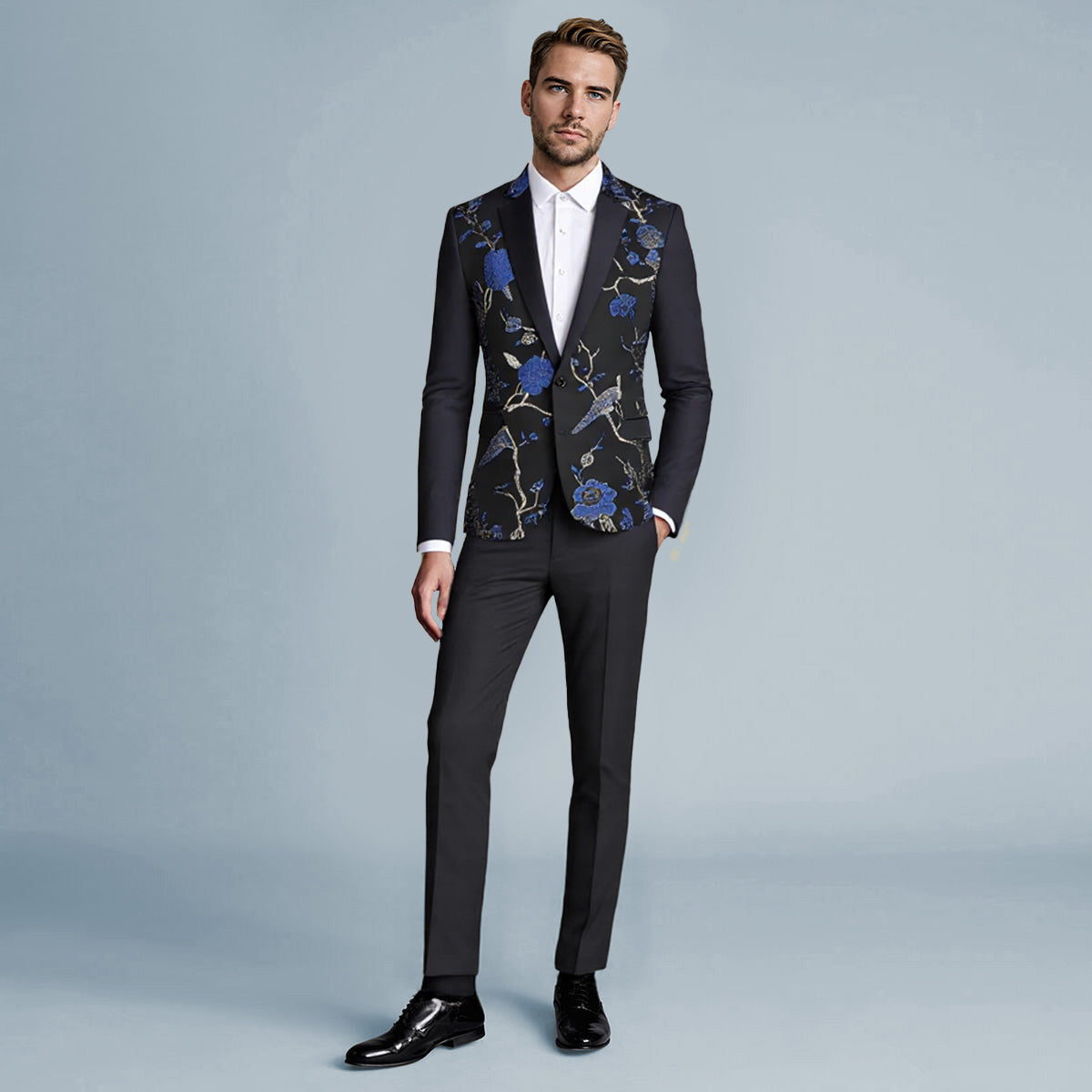 Blue # Men's slim fit 2-piece embroidered floral suit with notched lapel and single-breasted button closure, blue formal blazer jacket with center vent and fully lined interior, matching flat-front trousers for wedding, prom, party and formal occasions, isolated on white background.