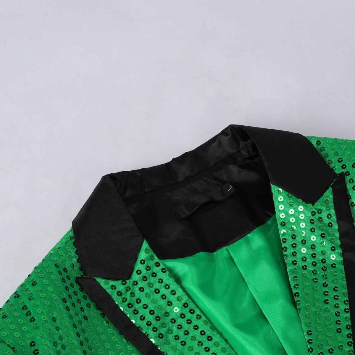 Green # Men's slim fit sequin decorated swallowtail coat with peaked lapel and single-breasted button closure, green sparkle tuxedo tailcoat with shining sequins for party, prom, stage performance, wedding and special events, isolated on white background.