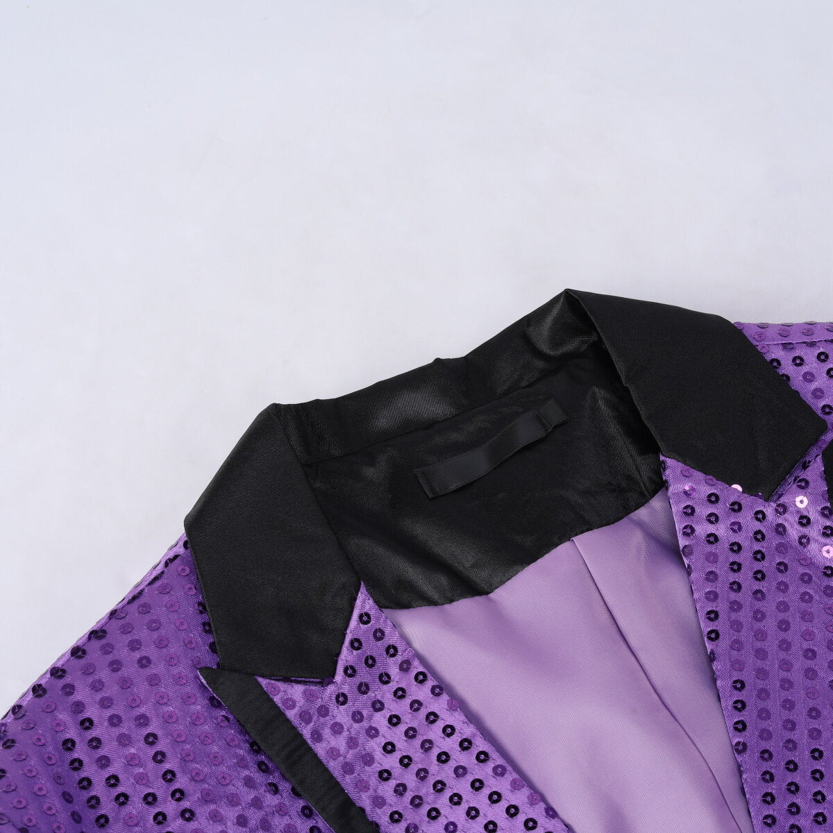 Purple # Men's slim fit sequin decorated swallowtail coat with peaked lapel and single-breasted button closure, purple sparkle tuxedo tailcoat with shining sequins for party, prom, stage performance, wedding and special events, isolated on white background.