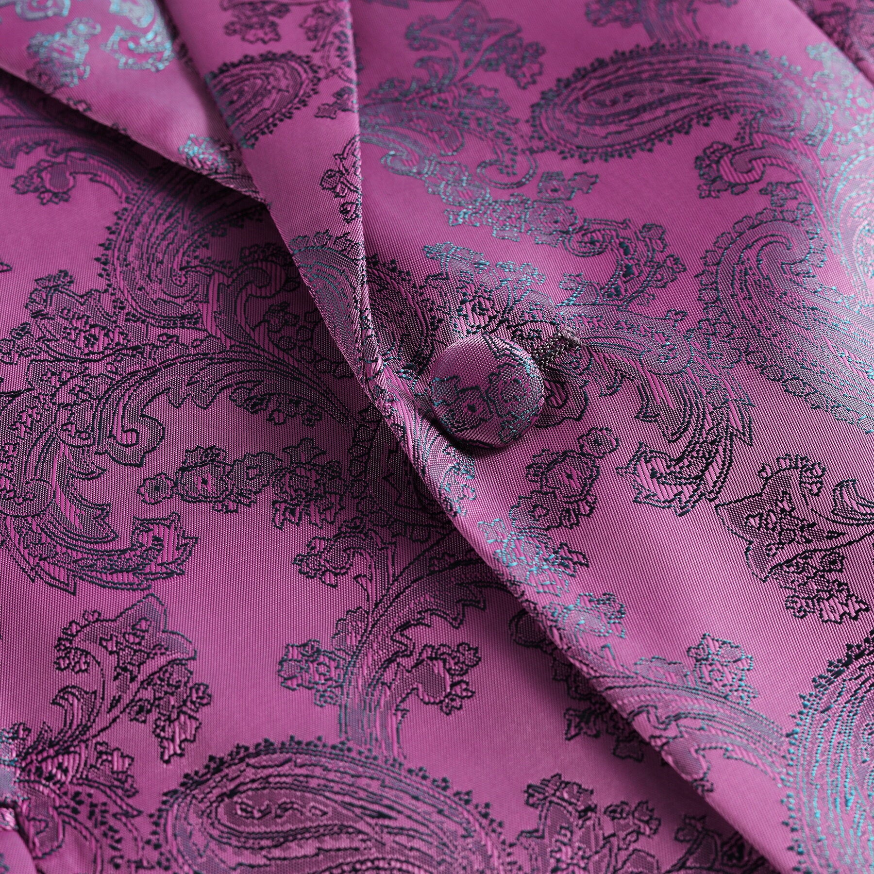 Fuchsia # Men's slim fit 2-piece paisley fashion suit with notch lapel and single-breasted button closure, fuchsia patterned formal blazer jacket with four-button cuffs and fully lined interior, matching flat-front trousers for party, wedding, prom and special occasions, isolated on white background.