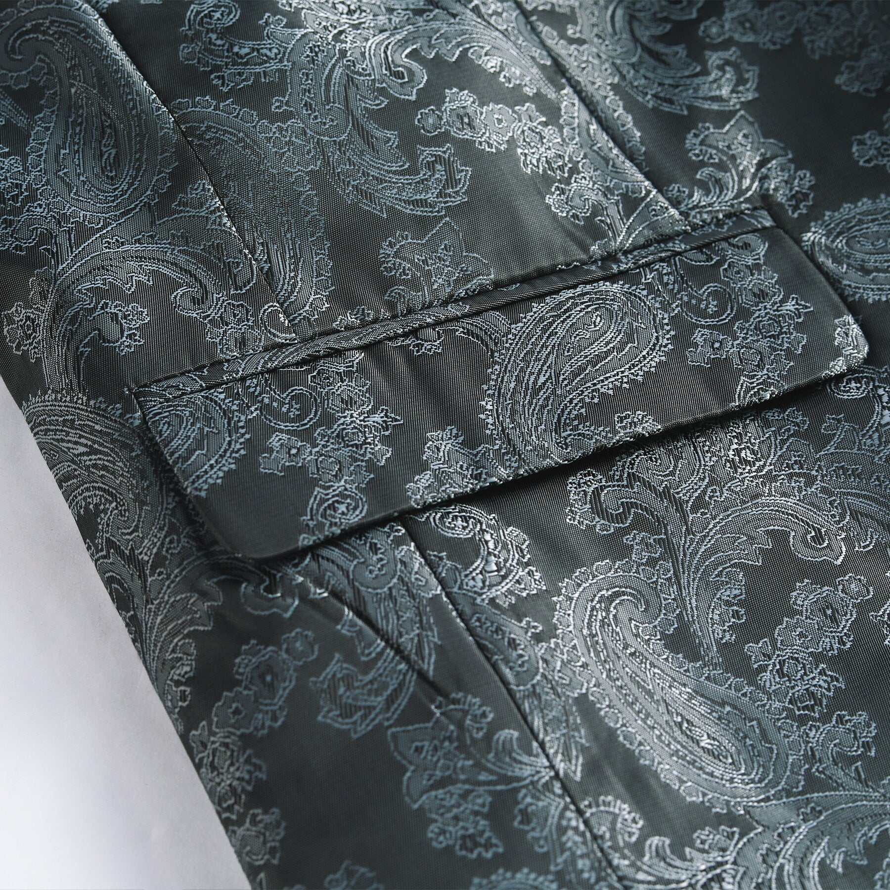 Grey # Men's slim fit 2-piece paisley fashion suit with notched lapel and single-breasted button closure, grey patterned formal blazer jacket with four-button cuffs and fully lined interior, matching flat-front trousers for party, wedding, prom and special occasions, isolated on white background.