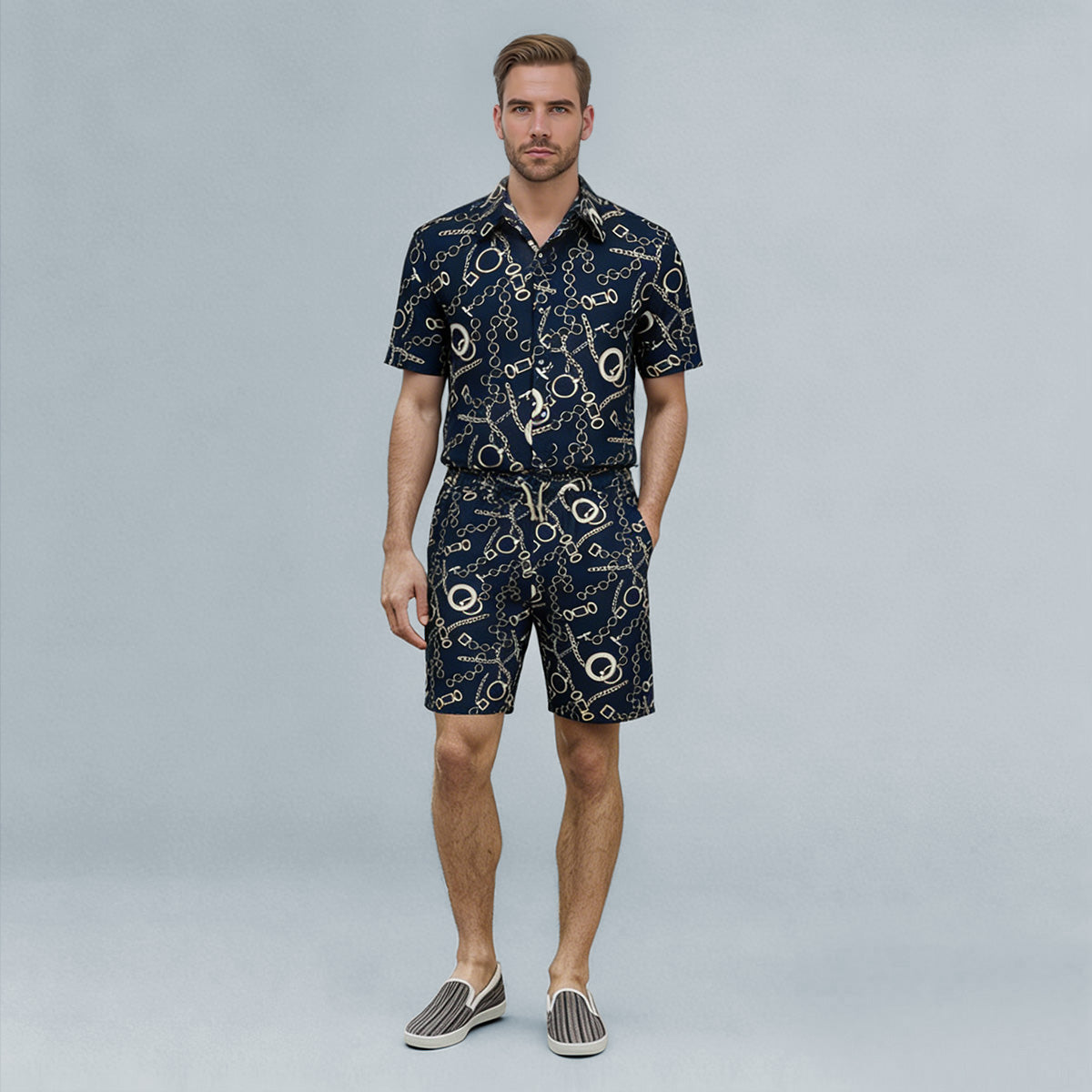 Navy # Men's slim fit 2-piece floral print suit with notched lapel and four-button cuffs, navy patterned blazer jacket with matching flat-front trousers with extended waist strap for wedding, prom, party and formal occasions, isolated on white background.