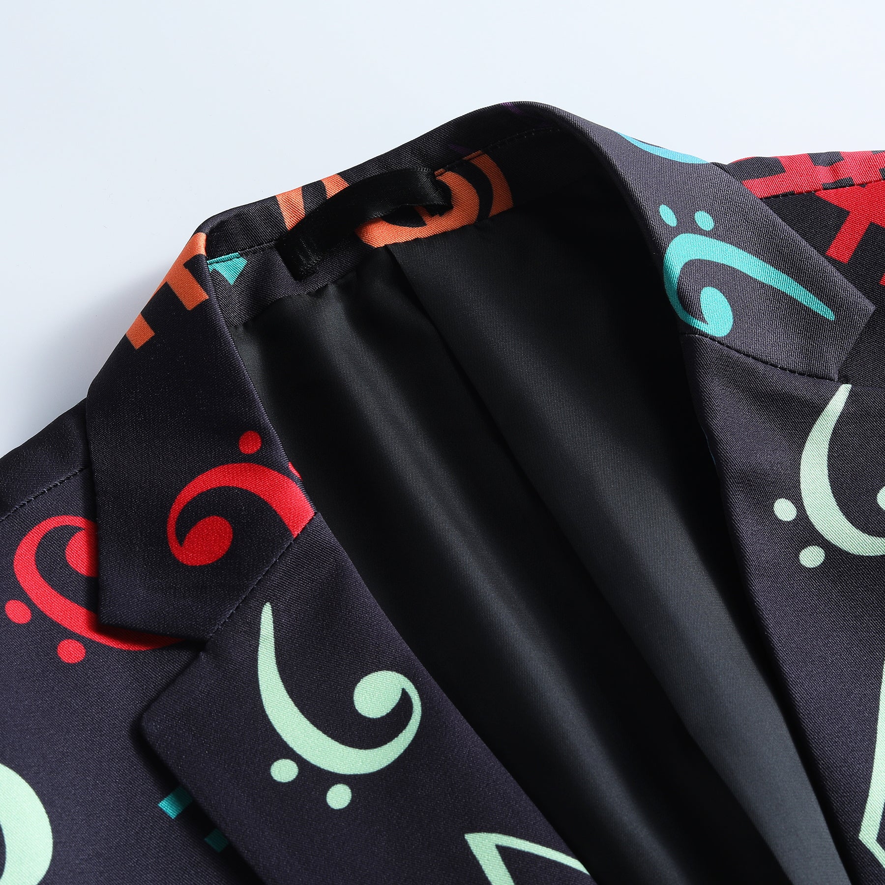 Black # Men's one-button musical note pattern printed blazer, single-breasted notch lapel sport coat with novelty music symbol print, cotton-poly blend jacket with back vent and three-button cuffs for party, concert, wedding and daily wear, isolated on white background.
