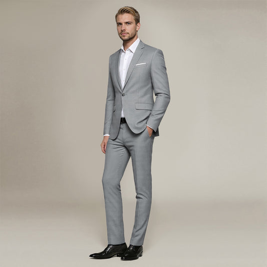 Light Grey # Men's slim fit 2-piece suit with peaked lapel and simple elegant design, light grey formal blazer jacket with four-button cuffs and matching flat-front trousers with extended waist strap for business, office, wedding and daily wear, isolated on white background.