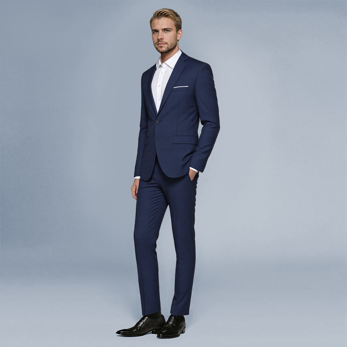Navy # Men's slim fit 2-piece suit with peaked lapel and simple elegant design, navy formal blazer jacket with four-button cuffs and matching flat-front trousers with extended waist strap for business, office, wedding and daily wear, isolated on white background.
