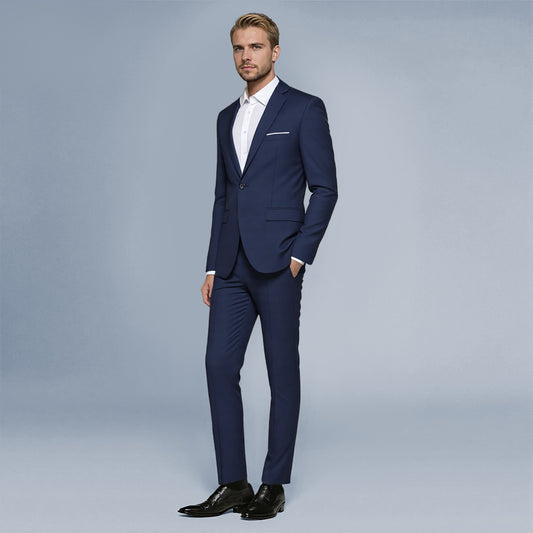 Navy # Men's slim fit 2-piece suit with peaked lapel and simple elegant design, navy formal blazer jacket with four-button cuffs and matching flat-front trousers with extended waist strap for business, office, wedding and daily wear, isolated on white background.