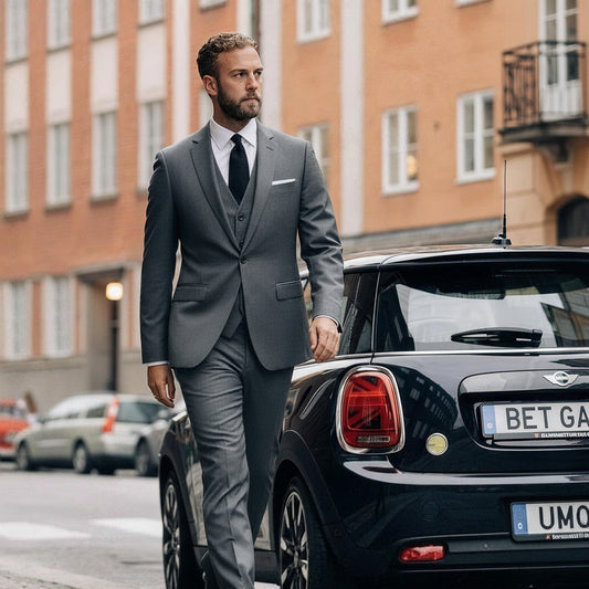Dimgrey # Men's slim fit 3-piece classic suit with one-button peaked lapel and button closure, dark grey formal blazer jacket with matching vest and flat-front trousers with extended waist strap and slanted side pockets, elegant polyester viscose blend suit for business, wedding, office and daily wear, isolated on white background.