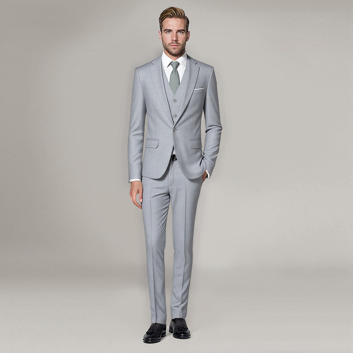 Light Grey # Men's 3-piece one-button slim fit formal suit with peaked lapel and button closure, light grey classic blazer jacket with matching vest and flat-front trousers with extended waist strap, elegant polyester suit for business, wedding, office and formal occasions, isolated on white background.