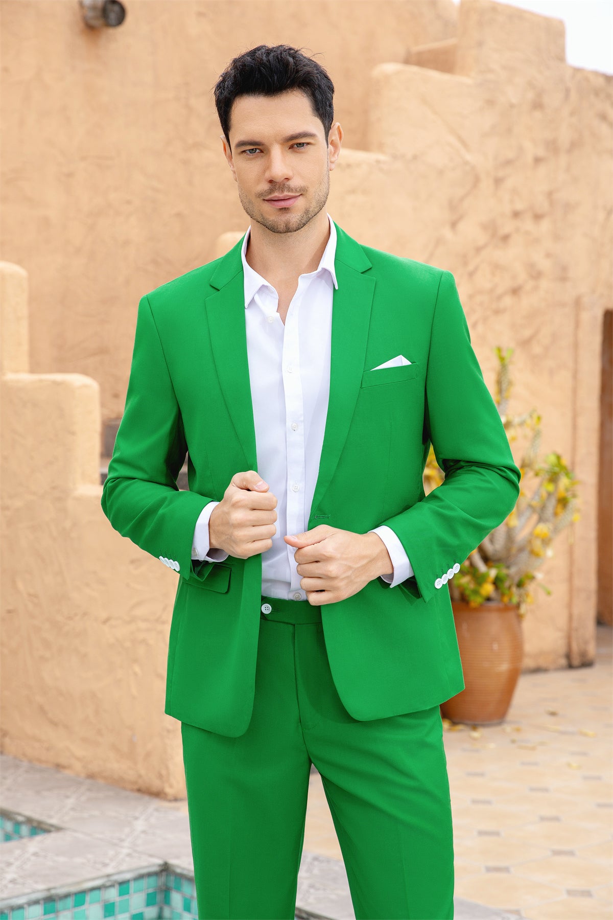 Green # Men's slim fit 2-piece simple designed casual suit with peaked lapel and button closure, green formal blazer jacket with four-button cuffs and matching flat-front trousers with extended waist strap, elegant polyester viscose blend suit for business, office, wedding and daily wear, isolated on white background.