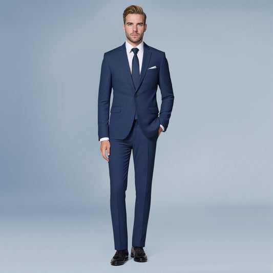 Navy # Men's slim fit 2-piece casual suit with peaked lapel and simple elegant design, navy formal blazer jacket with four-button sleeves and matching flat-front trousers with extended waist strap for business, office, wedding and daily wear, isolated on white background.