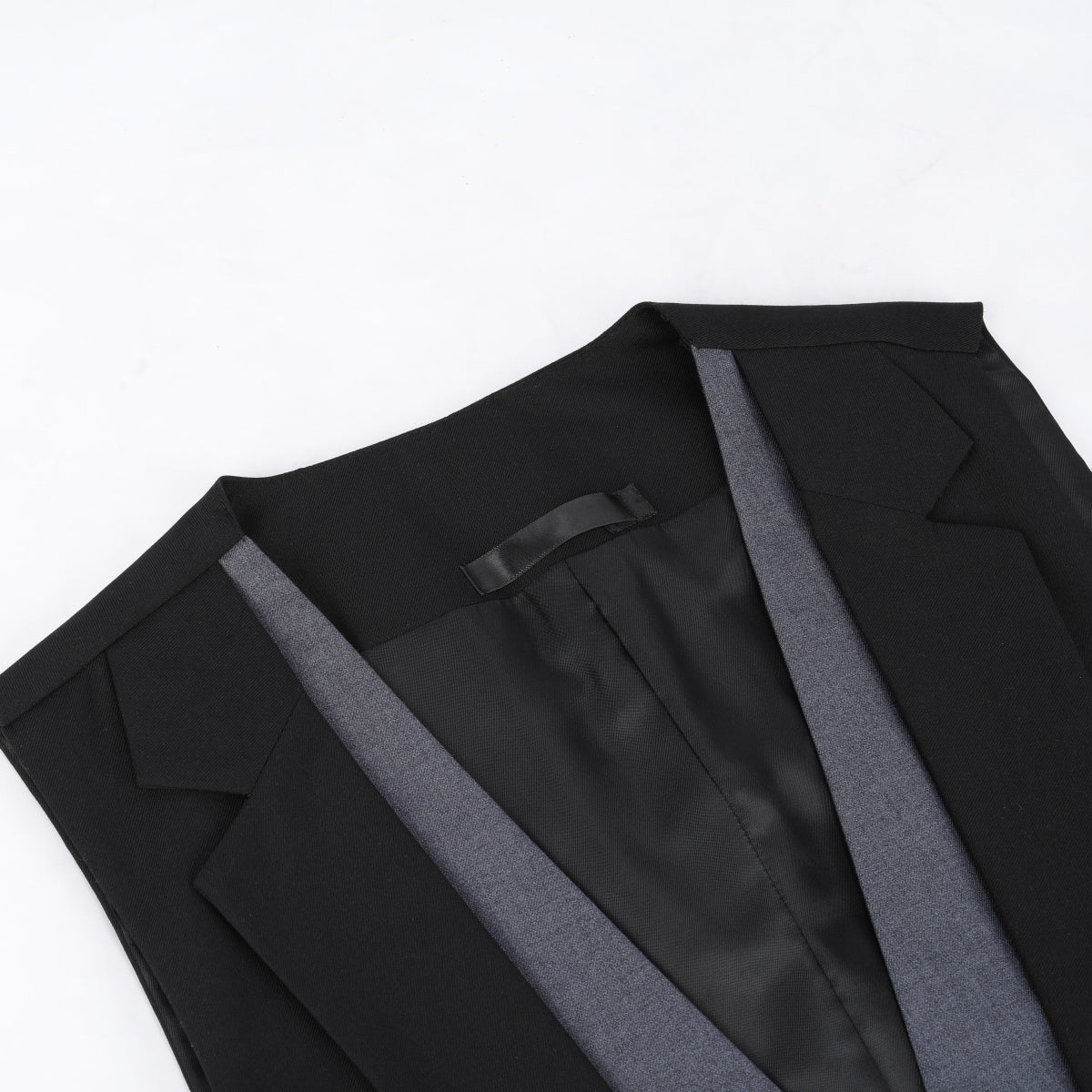 Black # Men's notched lapel patchwork vest, slim fit adjustable back waistcoat with minimalist buttons and structured shoulders, soft breathable fabric vest for business, party, wedding and daily wear, isolated on white background.