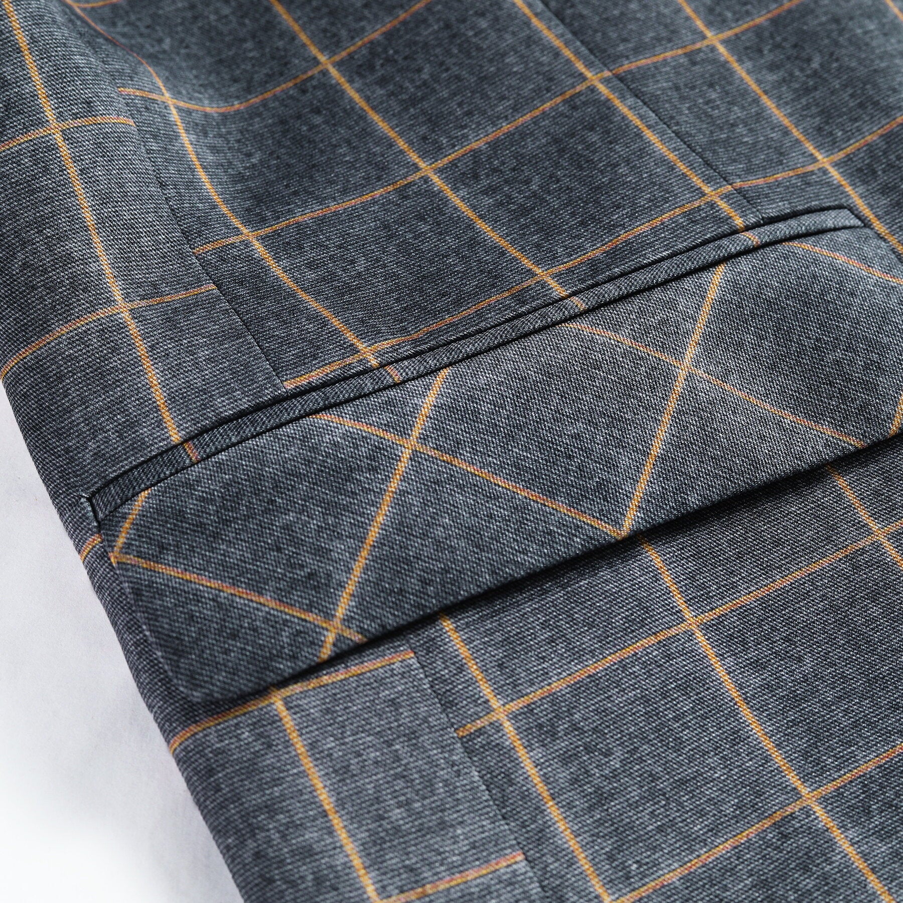 Grey Plaid # Men's slim fit 3-piece grey plaid modern suit with peaked lapel and button closure, classic tailored blazer jacket with matching vest and flat-front trousers with extended waist strap, elegant formal wear for business, wedding, prom and daily occasions, isolated on white background.