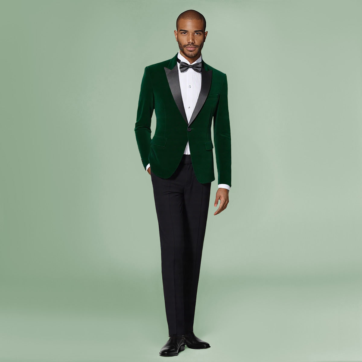 Green # Men's slim fit 2-piece pleuche velvet tuxedo suit with satin peaked lapel and single-breasted button closure, green formal blazer jacket with center back vent and fully lined interior, matching flat-front trousers for wedding, prom, party and formal occasions, isolated on white background.