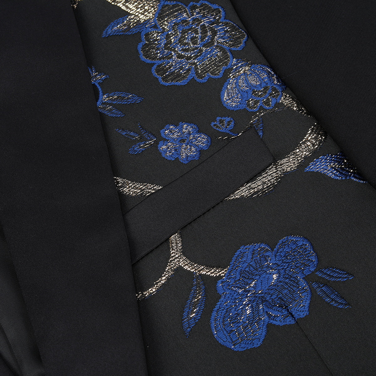 Blue # Men's slim fit 2-piece embroidered floral suit with notched lapel and single-breasted button closure, blue formal blazer jacket with center vent and fully lined interior, matching flat-front trousers for wedding, prom, party and formal occasions, isolated on white background.