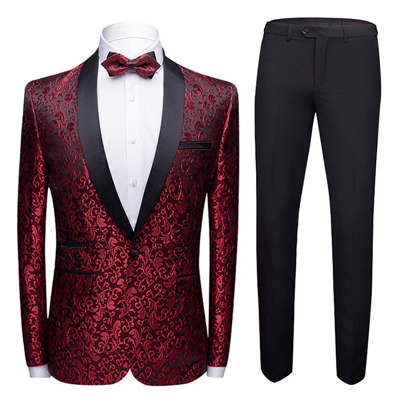 Maroon # Men's slim fit 2-piece paisley print suit with satin peaked lapel and single-breasted button closure, maroon patterned formal blazer jacket with center back vent and fully lined interior, matching flat-front trousers for wedding, prom, party and formal occasions, isolated on white background.
