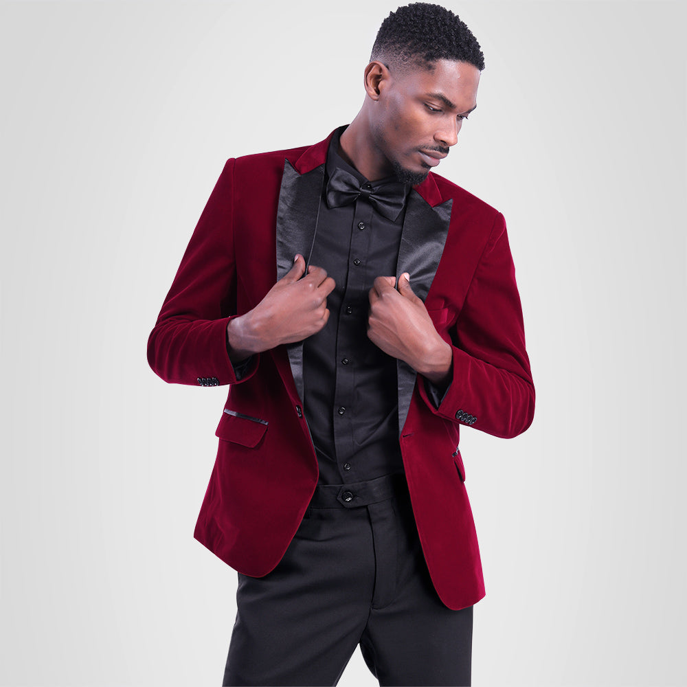 Maroon # Men's slim fit 2-piece pleuche velvet tuxedo suit with satin peaked lapel and single-breasted button closure, maroon formal blazer jacket with center vent and fully lined interior, matching flat-front trousers for wedding, prom, party and formal occasions, isolated on white background.