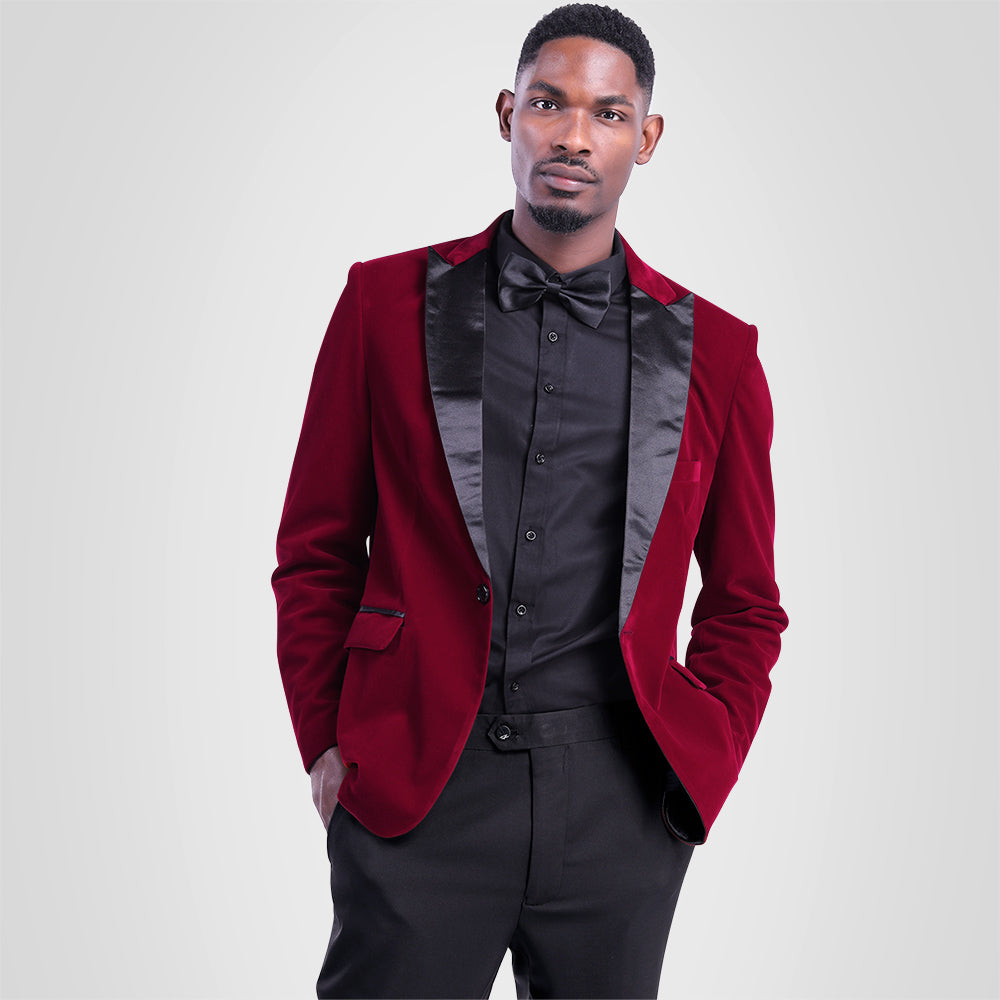 Maroon # Men's slim fit 2-piece pleuche velvet tuxedo suit with satin peaked lapel and single-breasted button closure, maroon formal blazer jacket with center vent and fully lined interior, matching flat-front trousers for wedding, prom, party and formal occasions, isolated on white background.